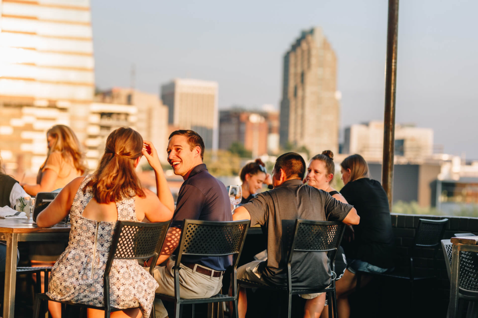 Young couples enjoying drinks and food at Wye Hill Brewing in Downtown Raleigh